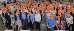 Large group of people wearing orange hats